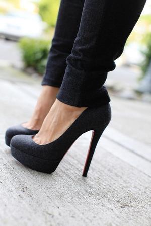 dark high high-heeled slippers and jeans