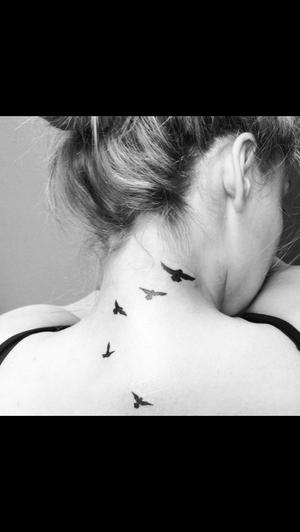 bird tattoo on neck