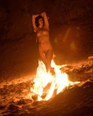 naked masculine fire dancer