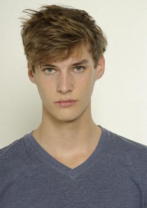 youthful male model blond hair blue eyes
