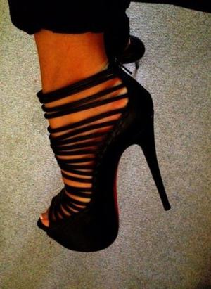 black strappy high heel boots