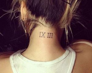 roman numeral tattoo on neck